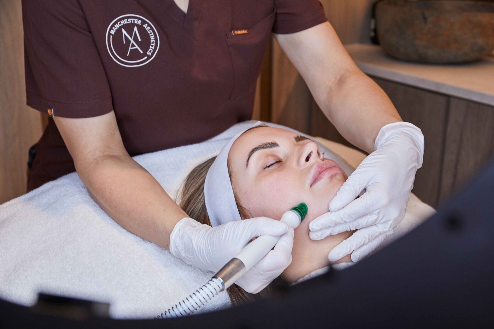 Hydro2 facial treatment being performed on a female client at a Manchester clinic